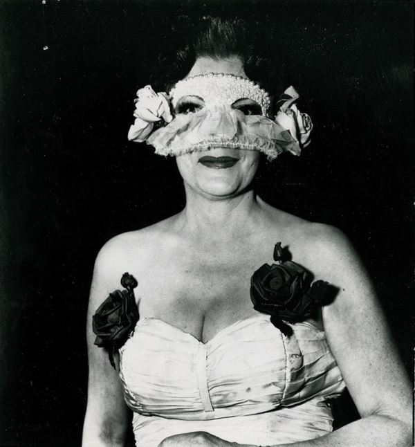 DIANE ARBUS - Lady at a masked ball with two roses in her dress,  NYC